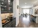 Butler's pantry featuring sleek black countertops, custom cabinetry, and seamless transition to the kitchen and dining area at 3224 Lanier Ne Dr, Atlanta, GA 30319