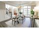 Bright dining room with stylish chandelier, large windows, and views of front yard at 3224 Lanier Ne Dr, Atlanta, GA 30319