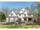 Stunning painted brick home featuring manicured landscaping and a charming front porch at 3224 Lanier Ne Dr, Atlanta, GA 30319
