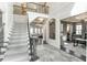 Grand foyer with elegant staircase, marble floors, and an open view to living spaces at 3224 Lanier Ne Dr, Atlanta, GA 30319