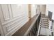 Upstairs hallway with hardwood floors, carpeted stairs, and detailed trim work at 3224 Lanier Ne Dr, Atlanta, GA 30319