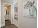 Hallway view with a bathroom and bedroom with decorative mirror and chandelier at 3224 Lanier Ne Dr, Atlanta, GA 30319