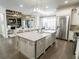Open-concept kitchen featuring a granite island, stainless steel appliances, and a seamless flow into the living area at 3224 Lanier Ne Dr, Atlanta, GA 30319
