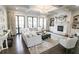 Comfortable living room featuring a fireplace, built-in shelves, and coffered ceiling at 3224 Lanier Ne Dr, Atlanta, GA 30319