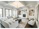 Bright and airy living room featuring a cozy fireplace, built-in shelves, and coffered ceiling at 3224 Lanier Ne Dr, Atlanta, GA 30319