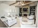 Elegant living room features a stone fireplace, built-in shelving, and neutral decor for a cozy atmosphere at 3224 Lanier Ne Dr, Atlanta, GA 30319