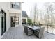 Outdoor patio with a dining table and a view of the trees at 3224 Lanier Ne Dr, Atlanta, GA 30319