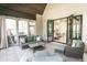 Beautiful patio with stone fireplace, ample seating, and large glass doors for natural light at 3224 Lanier Ne Dr, Atlanta, GA 30319