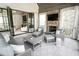 Relaxing patio with comfortable seating, a stone fireplace, and seamless indoor-outdoor transition at 3224 Lanier Ne Dr, Atlanta, GA 30319