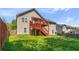 Large backyard with a deck and grassy area, perfect for outdoor activities and relaxation at 6983 Pine Shadow Way, Winston, GA 30187