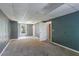 Unfinished basement with concrete floor and gray walls, offering ample potential for customization at 6983 Pine Shadow Way, Winston, GA 30187