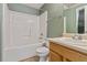 Clean bathroom featuring a shower-tub, single sink vanity, and a well-maintained neutral-tone decor at 6983 Pine Shadow Way, Winston, GA 30187