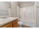 Compact bathroom featuring a shower-tub combo, single-sink vanity, and neutral color scheme at 6983 Pine Shadow Way, Winston, GA 30187