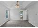 Large main bedroom featuring plush carpeting, a ceiling fan, and an ensuite bathroom at 6983 Pine Shadow Way, Winston, GA 30187