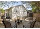 Inviting backyard with paver patio, fire pit, string lights and outdoor seating at 91 Chester Se Aly, Atlanta, GA 30316