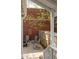 Private backyard patio with chairs, brick wall, and wooden fence at 91 Chester Se Aly, Atlanta, GA 30316