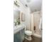 Small bathroom featuring tiling, a toilet, modern fixtures, and a standing shower at 91 Chester Se Aly, Atlanta, GA 30316