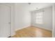 Bare bedroom featuring hardwood floors, neutral paint, and window at 91 Chester Se Aly, Atlanta, GA 30316