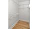 Walk in closet featuring installed wire shelving and wooden floor at 91 Chester Se Aly, Atlanta, GA 30316