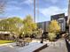 Exterior daytime shot of building with patio seating and picnic tables at 91 Chester Se Aly, Atlanta, GA 30316