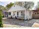 Inviting home featuring a cozy front porch, well-maintained landscaping, and driveway at 91 Chester Se Aly, Atlanta, GA 30316