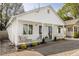 Charming home featuring a welcoming front porch with seating and fresh landscaping at 91 Chester Se Aly, Atlanta, GA 30316