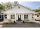 Charming home featuring a welcoming front porch, black front door, and beautifully landscaped front yard at 91 Chester Se Aly, Atlanta, GA 30316