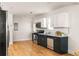 Modern kitchen featuring stainless steel appliances, white countertops, and dark blue cabinets at 91 Chester Se Aly, Atlanta, GA 30316