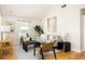 Bright living room features hardwood floors, neutral furniture, large windows, and stylish decor at 91 Chester Se Aly, Atlanta, GA 30316