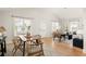 Open floor plan featuring a dining table and stylish living room with natural light at 91 Chester Se Aly, Atlanta, GA 30316