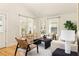 Bright living room features hardwood floors, neutral furniture, large windows, and stylish decor at 91 Chester Se Aly, Atlanta, GA 30316