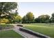 Outdoor view of green park with winding walkway and mature trees at 91 Chester Se Aly, Atlanta, GA 30316