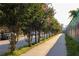 Street view lined with trees featuring a vibrant sidewalk and city landscape at 91 Chester Se Aly, Atlanta, GA 30316