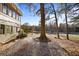Backyard view featuring a large tree and expansive golf course beyond at 138 Elysian Nw Way, Atlanta, GA 30327