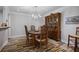 Elegant dining room with a wood table, chairs, and a china cabinet, perfect for entertaining guests at 138 Elysian Nw Way, Atlanta, GA 30327