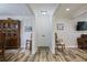 Inviting foyer with a wood front door, hard surface flooring, and neutral walls, providing a warm welcome at 138 Elysian Nw Way, Atlanta, GA 30327
