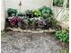 Charming garden area adorned with potted plants and decorative stone accents for outdoor enjoyment at 138 Elysian Nw Way, Atlanta, GA 30327