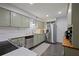 Well-equipped kitchen features stainless steel appliances, updated cabinetry, and white subway tile backsplash at 138 Elysian Nw Way, Atlanta, GA 30327