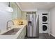 Modern kitchen area showcasing stainless steel appliances, white countertops, and a tile backsplash at 138 Elysian Nw Way, Atlanta, GA 30327