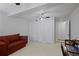 Spacious office space with neutral carpet, ceiling fan, and a red sofa at 138 Elysian Nw Way, Atlanta, GA 30327