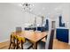 Charming dining area with modern lighting fixtures, seamlessly connecting to a stylish kitchen at 2105 Rotunda Ct, Conyers, GA 30094