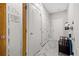 Hallway with a pantry, multiple doors, and marble floors at 2105 Rotunda Ct, Conyers, GA 30094
