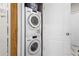 Modern laundry closet featuring stacked Miele washer and dryer units for efficient space-saving at 2105 Rotunda Ct, Conyers, GA 30094