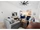 Spacious living room with a cozy fireplace, vaulted ceiling, and comfortable seating arrangement at 2105 Rotunda Ct, Conyers, GA 30094