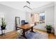 Well-lit home office offering a quiet workspace with stylish decor and neighborhood views at 2105 Rotunda Ct, Conyers, GA 30094