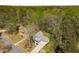 Aerial view of a charming home with a well-manicured lawn and lush landscaping at 3021 Favor Pines Sw Ct, Marietta, GA 30060