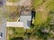 Aerial view showcases the home's roof and surrounding landscape with mature trees and lush greenery at 3021 Favor Pines Sw Ct, Marietta, GA 30060