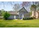 Expansive backyard features a lush lawn and well-maintained landscaping for outdoor enjoyment at 3021 Favor Pines Sw Ct, Marietta, GA 30060
