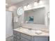 Well-lit bathroom with a large mirror, updated fixtures, and a decorative stained glass window at 3021 Favor Pines Sw Ct, Marietta, GA 30060