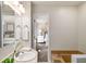 Well-lit bathroom featuring a combination shower and tub, opening to the bedroom at 3021 Favor Pines Sw Ct, Marietta, GA 30060